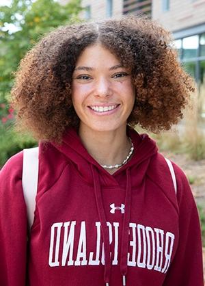 Smiling student, close up, outside in RIC sweatshirt